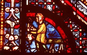 Un boucher, détail du coin inférieur gauche de la fenêtre des Miracles de la Vierge dans le bas-côté sud de la nef, 1205-15 - French School